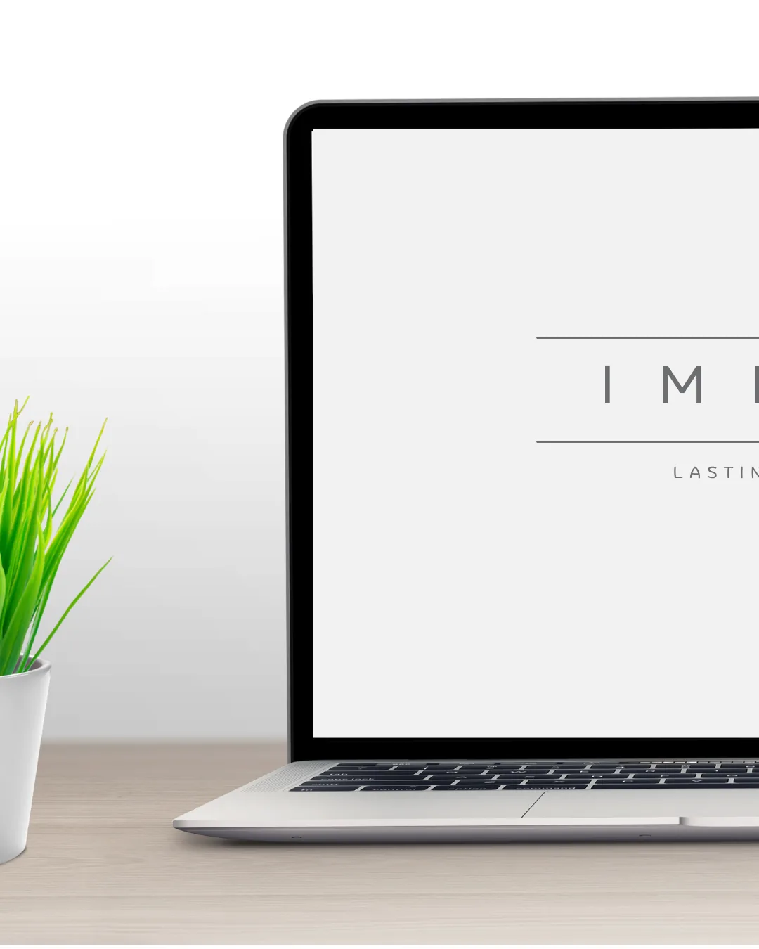 Laptop showing IMPACT - Lasting Impression logo
